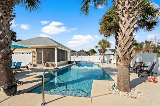 view of pool featuring a sunroom and a patio