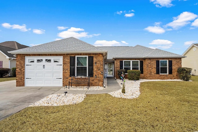 ranch-style house featuring a garage and a front lawn