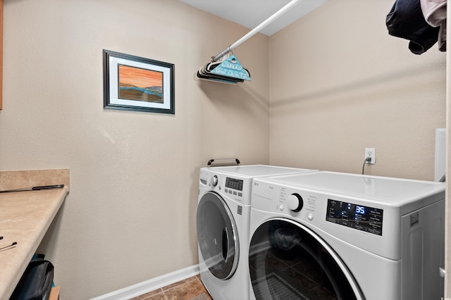 clothes washing area featuring washing machine and clothes dryer