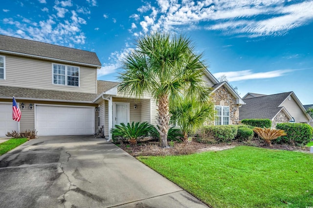 view of front of home featuring a garage and a front yard