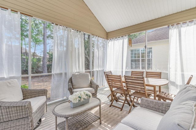 sunroom / solarium with vaulted ceiling and a wealth of natural light