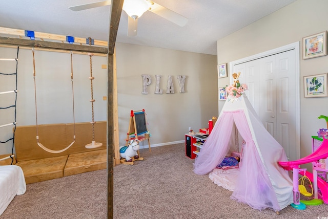 playroom with ceiling fan and carpet flooring