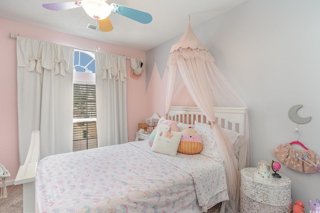 bedroom with ceiling fan and carpet floors