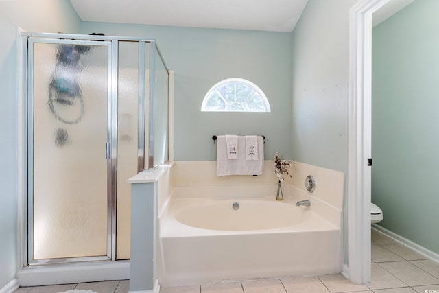 bathroom with tile patterned flooring, plus walk in shower, and toilet