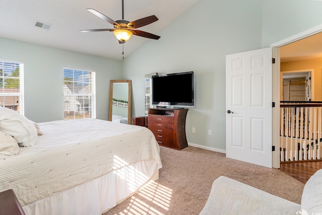 bedroom featuring ceiling fan, carpet flooring, and high vaulted ceiling