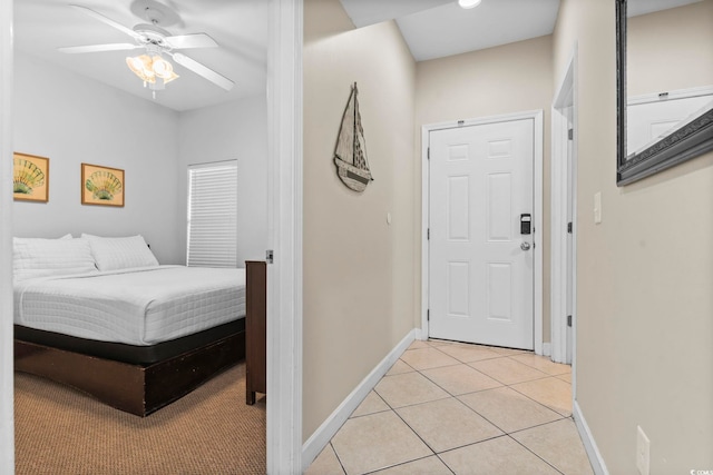 tiled bedroom with ceiling fan