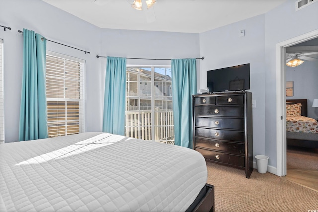 carpeted bedroom with ceiling fan