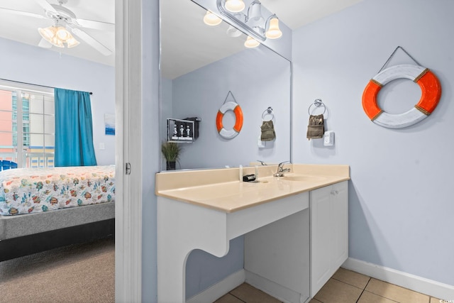 bathroom featuring ceiling fan, vanity, and tile patterned flooring