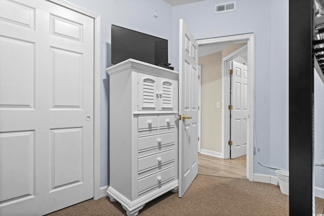 hallway with carpet floors