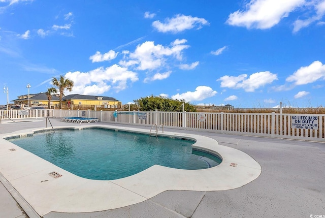 view of pool featuring a patio area