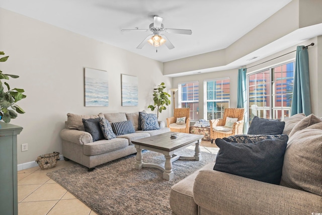 tiled living room featuring ceiling fan