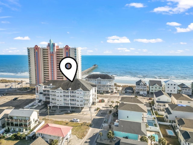 aerial view featuring a water view and a beach view