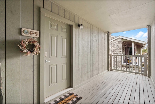 property entrance with covered porch