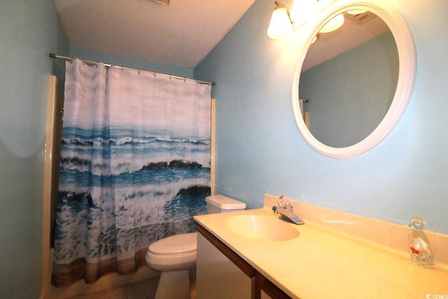 bathroom with a shower with curtain, vanity, tile patterned flooring, and toilet