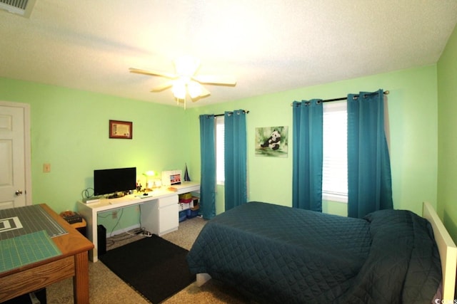 bedroom featuring light colored carpet and ceiling fan