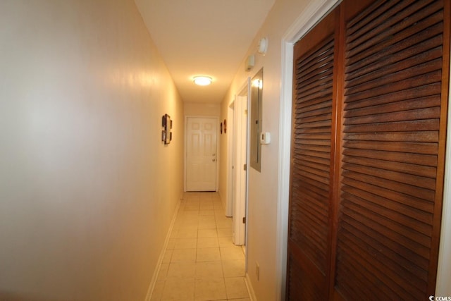 corridor featuring light tile patterned flooring