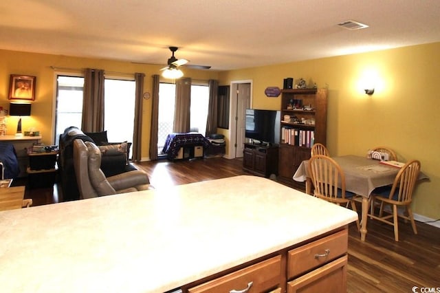 kitchen featuring dark hardwood / wood-style floors and ceiling fan