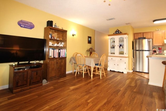 dining area with dark hardwood / wood-style floors