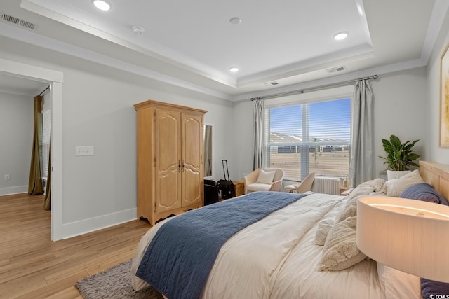 6614 Torino Ln, Myrtle Beach, SC 29572 - bedroom featuring a raised ceiling, light wood-type flooring, and recessed lighting