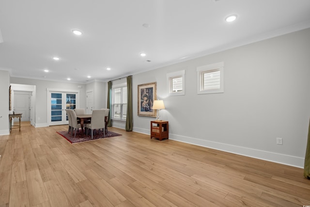 unfurnished dining area with crown molding and light hardwood / wood-style floors