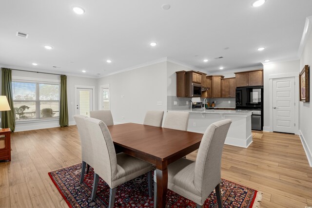 6614 Torino Ln, Myrtle Beach, SC 29572 - dining area with ornamental molding, recessed lighting, light wood-style flooring, and baseboards