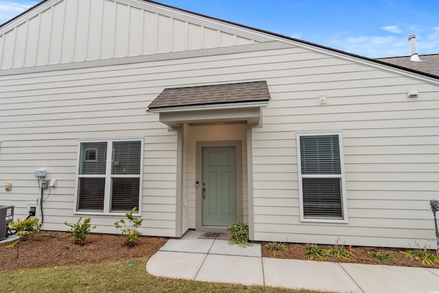 6614 Torino Ln, Myrtle Beach, SC 29572 - doorway to property with roof with shingles and board and batten siding