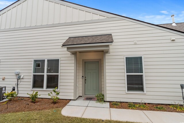 6614 Torino Ln, Myrtle Beach, SC 29572 - entrance to property featuring a shingled roof and board and batten siding