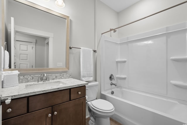 full bathroom featuring shower / bathing tub combination, vanity, and toilet