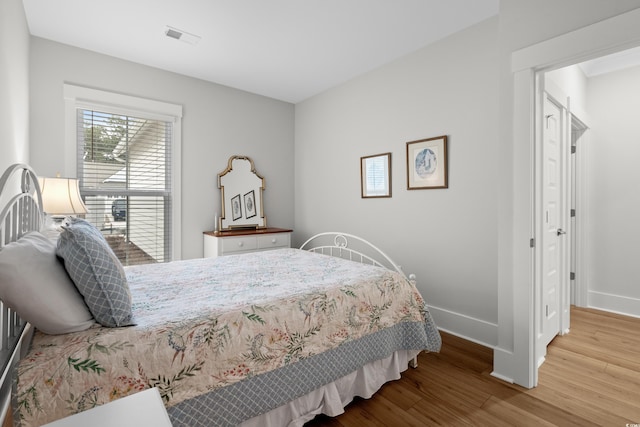 bedroom featuring hardwood / wood-style floors