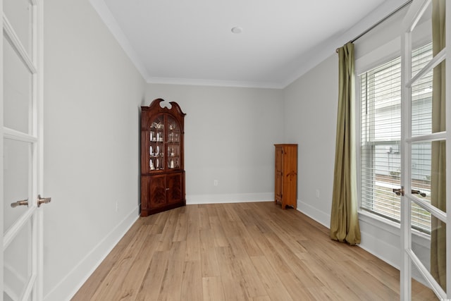 interior space with crown molding and light hardwood / wood-style floors