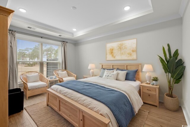 6614 Torino Ln, Myrtle Beach, SC 29572 - bedroom with a raised ceiling, light wood-style flooring, and recessed lighting