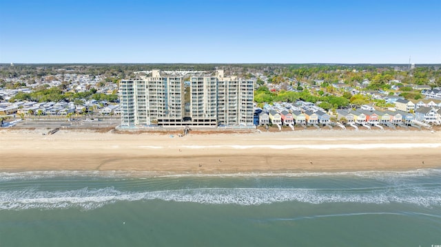 bird's eye view featuring a water view and a view of the beach