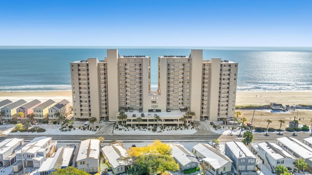 aerial view with a view of the beach and a water view