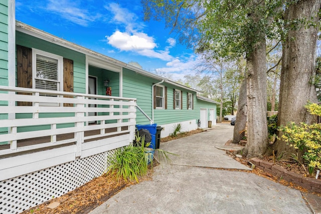 view of property exterior featuring covered porch