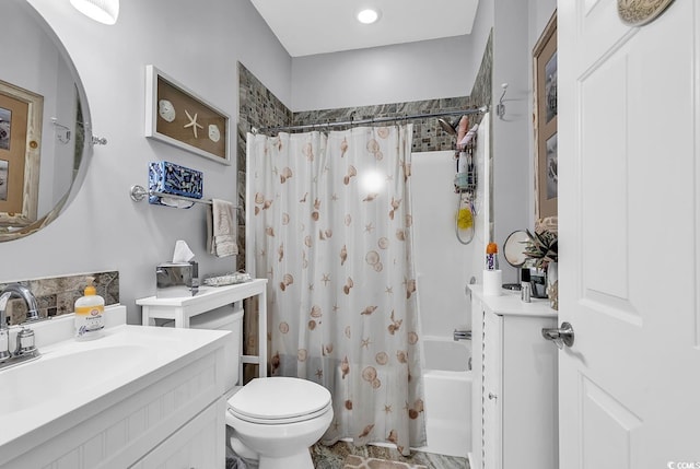 full bathroom with vanity, shower / tub combo with curtain, and toilet