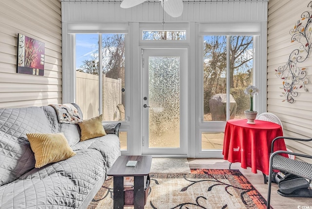 sunroom with plenty of natural light and ceiling fan