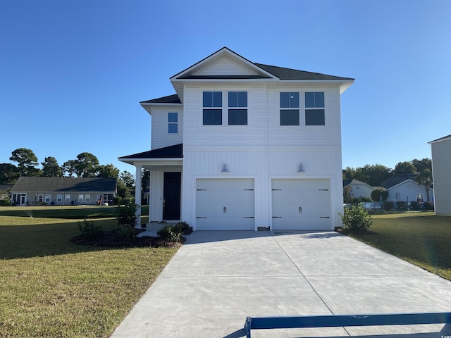 view of front of home with a garage and a front yard