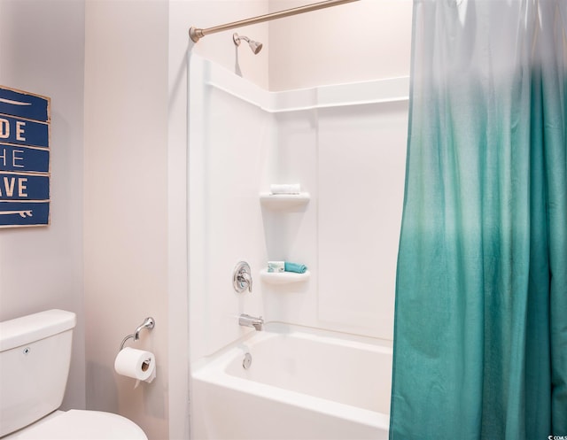 bathroom featuring shower / bath combination with curtain and toilet