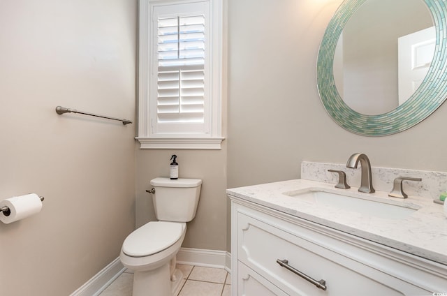 bathroom featuring vanity, tile patterned floors, and toilet