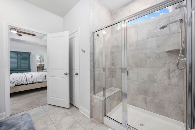 bathroom featuring walk in shower, ceiling fan, and tile patterned flooring