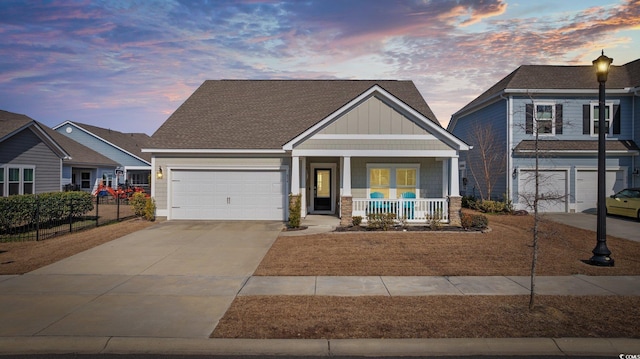 craftsman inspired home featuring a porch and a garage