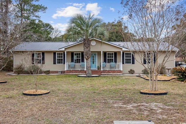 single story home featuring a front lawn and covered porch