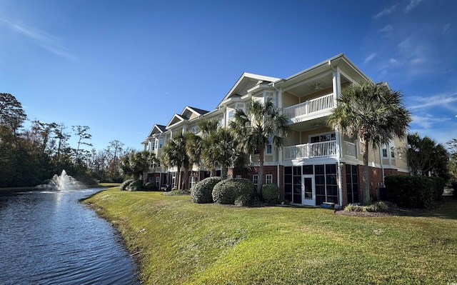 view of building exterior with a water view