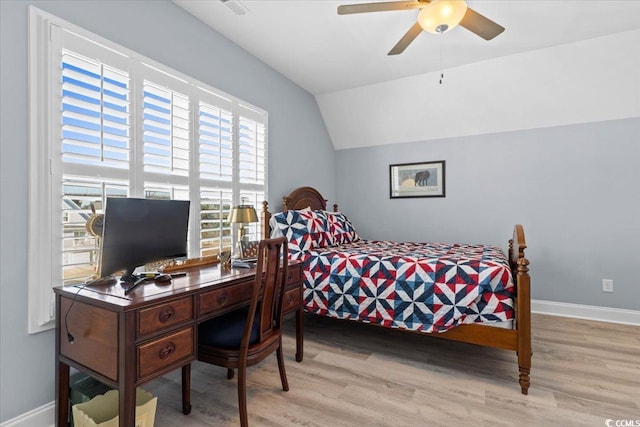 bedroom featuring lofted ceiling and light wood-type flooring