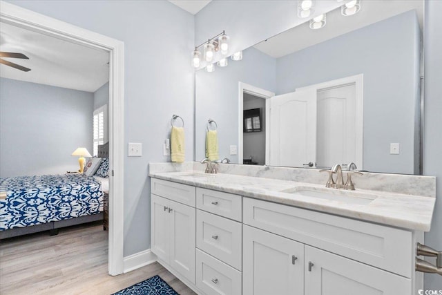 bathroom with vanity, hardwood / wood-style floors, and ceiling fan