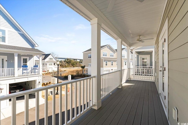 wooden terrace featuring ceiling fan