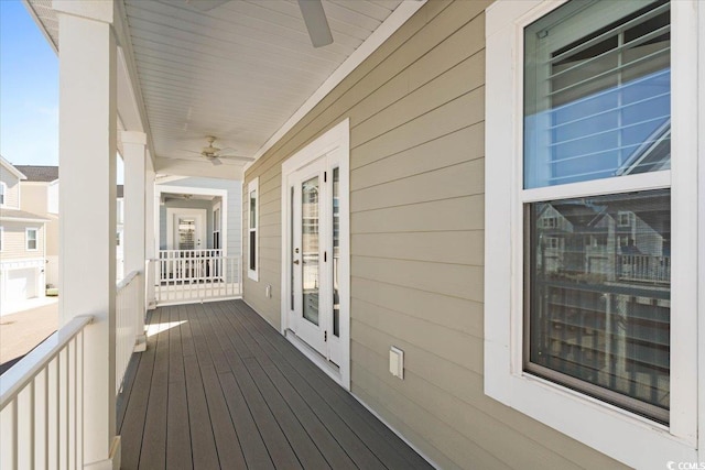 wooden deck with ceiling fan and covered porch