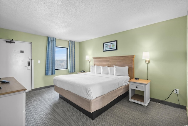 carpeted bedroom with a textured ceiling