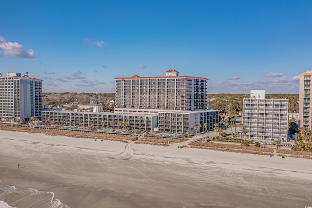 view of building exterior featuring a beach view