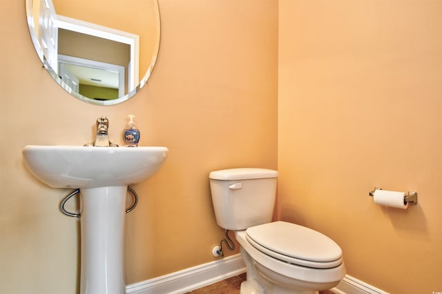 bathroom with tile patterned floors and toilet